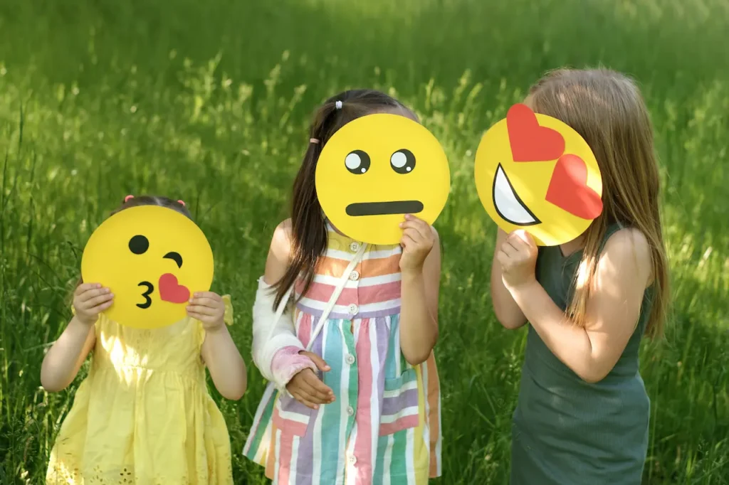 ChIldren Playing with Emojie Mask