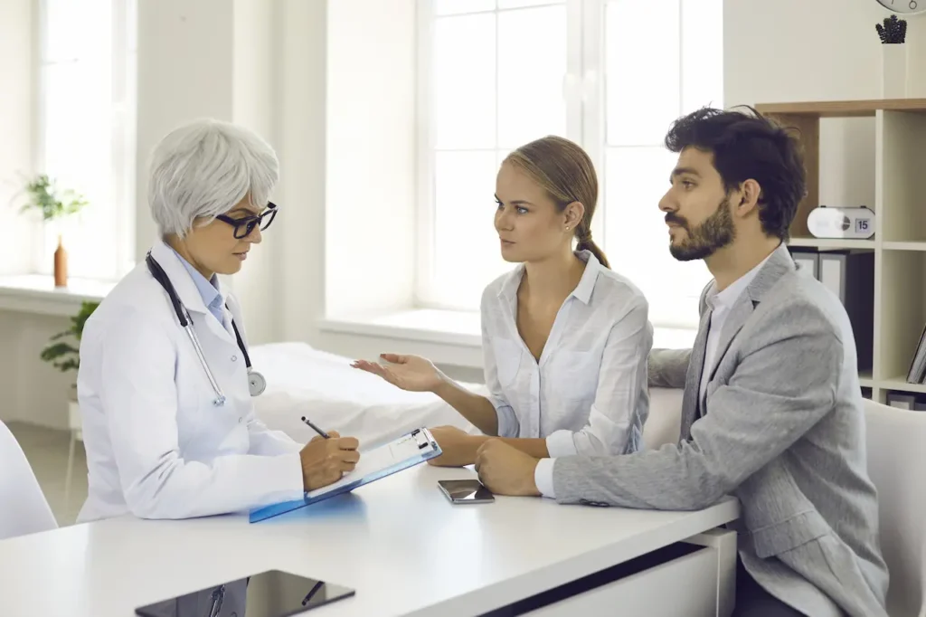 Couple Discussing With the Doctor
