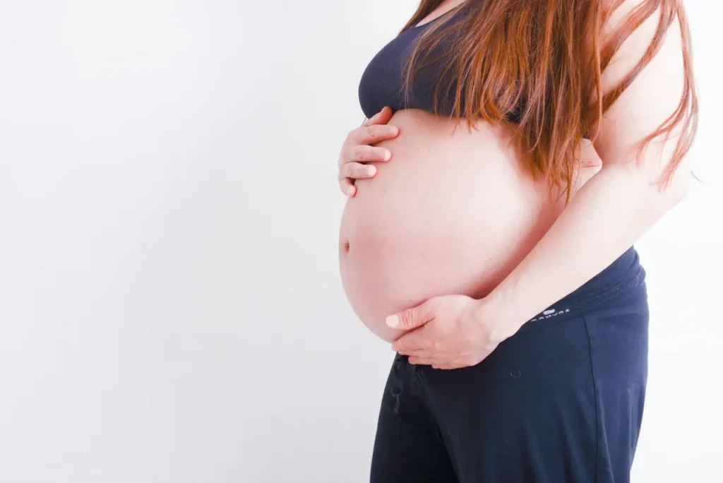 Pregnant Woman Holding Her Belly